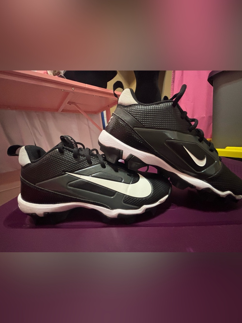 Nike Black and White Kids Athletic Cleats with Swoosh - “Nike Fastflex” cleats.